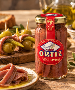 Ortiz Anchovies in Olive Oil jar with traditional Spanish Gildas, green olives and guindilla peppers